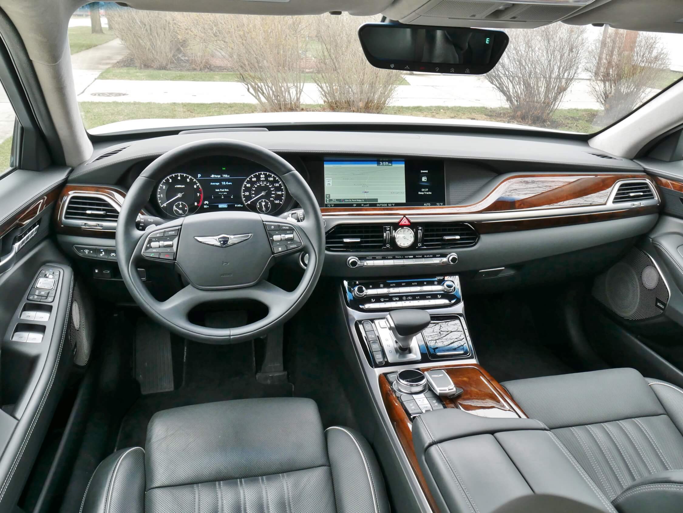 2018 Genesis G90 3.3T AWD: Cockpit is a lesson in minimal control and little expense spared in finish materials: Brushed aluminum switches, wood veneer inlays, satin finish leathers, alcantara suede pillar & headliners