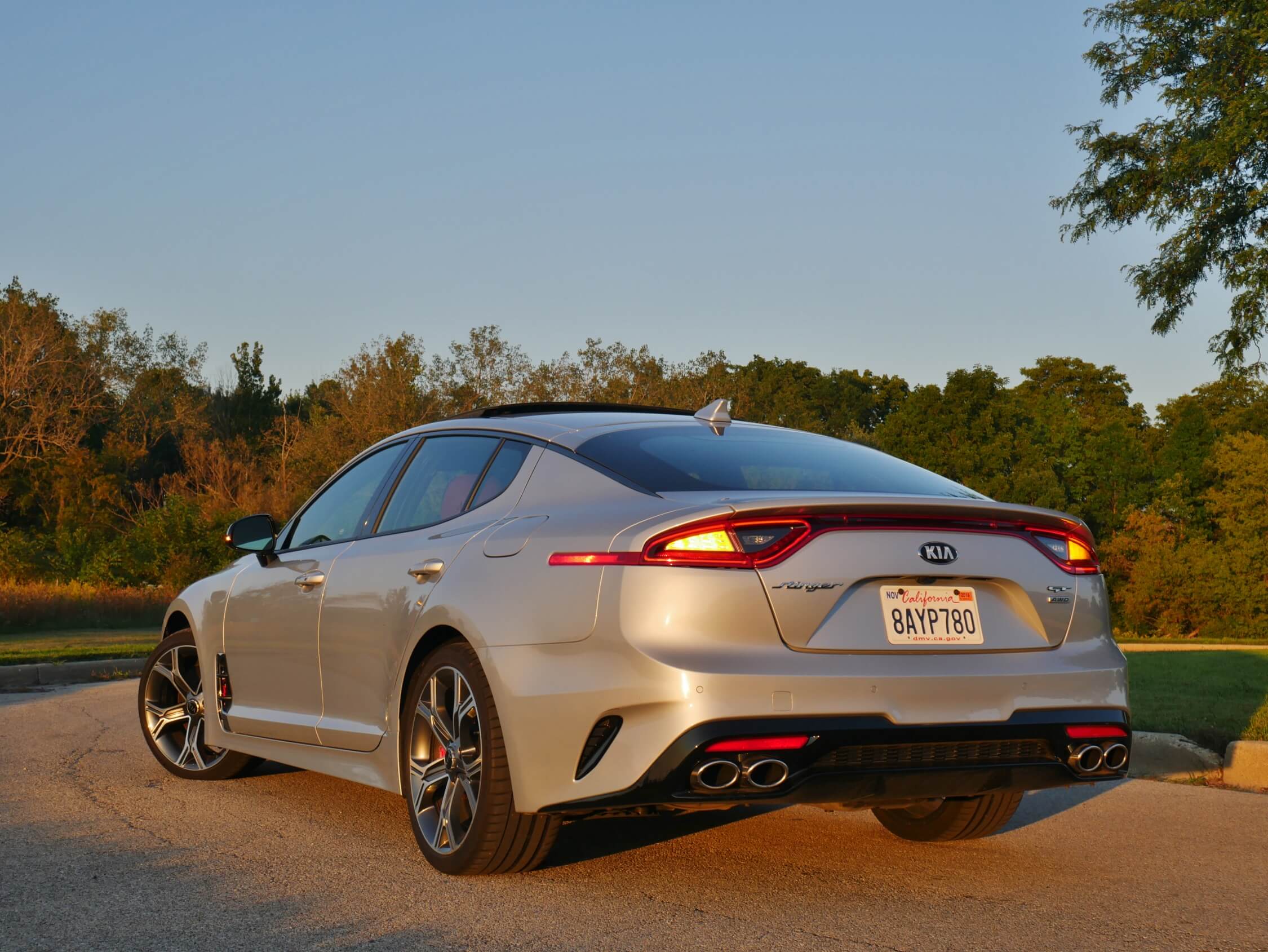 2018 Kia Stinger GT2 AWD: Beveled Kammback liftgate, darkened lower simulated diffuser, dual twin oval exhaust ports, accented by dark lower rear corner fangs.