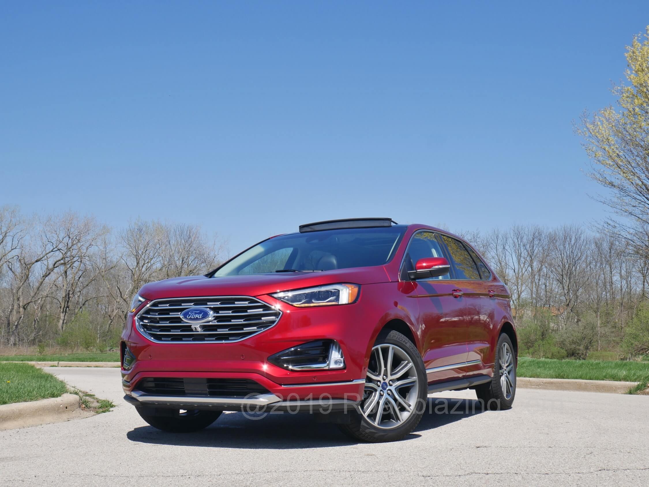 2019 Ford Edge Titanium AWD: Usual suspects in mid-cycle refresh = cinched grille, tweezed lights, bolder front lower corner recesses, simulated skid plates and more chrome