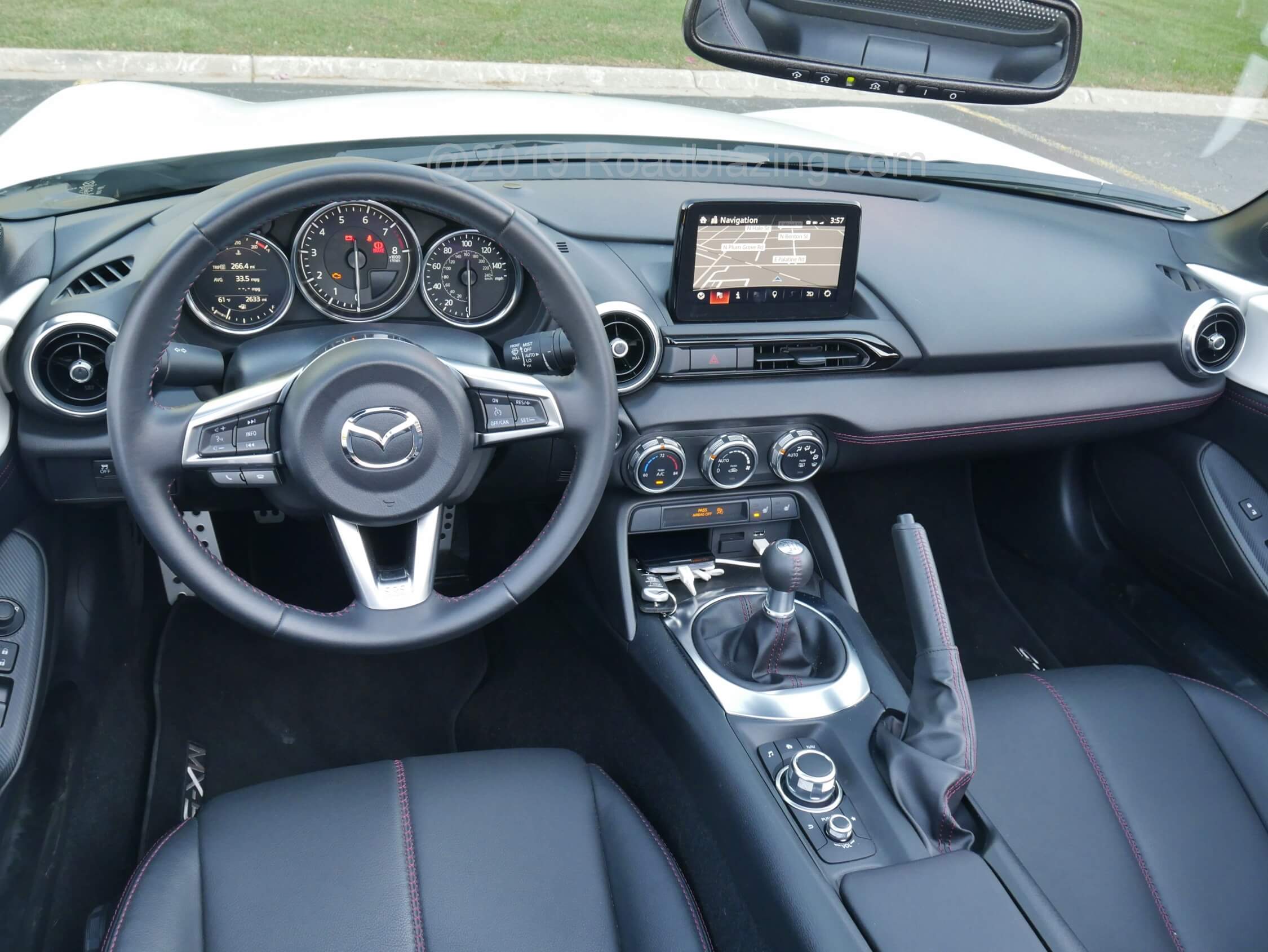 2019 Mazda MX-5 Grand Touring: Sensible cockpit derives pleasingly upscale touches from Mazda sedans / crossovers.