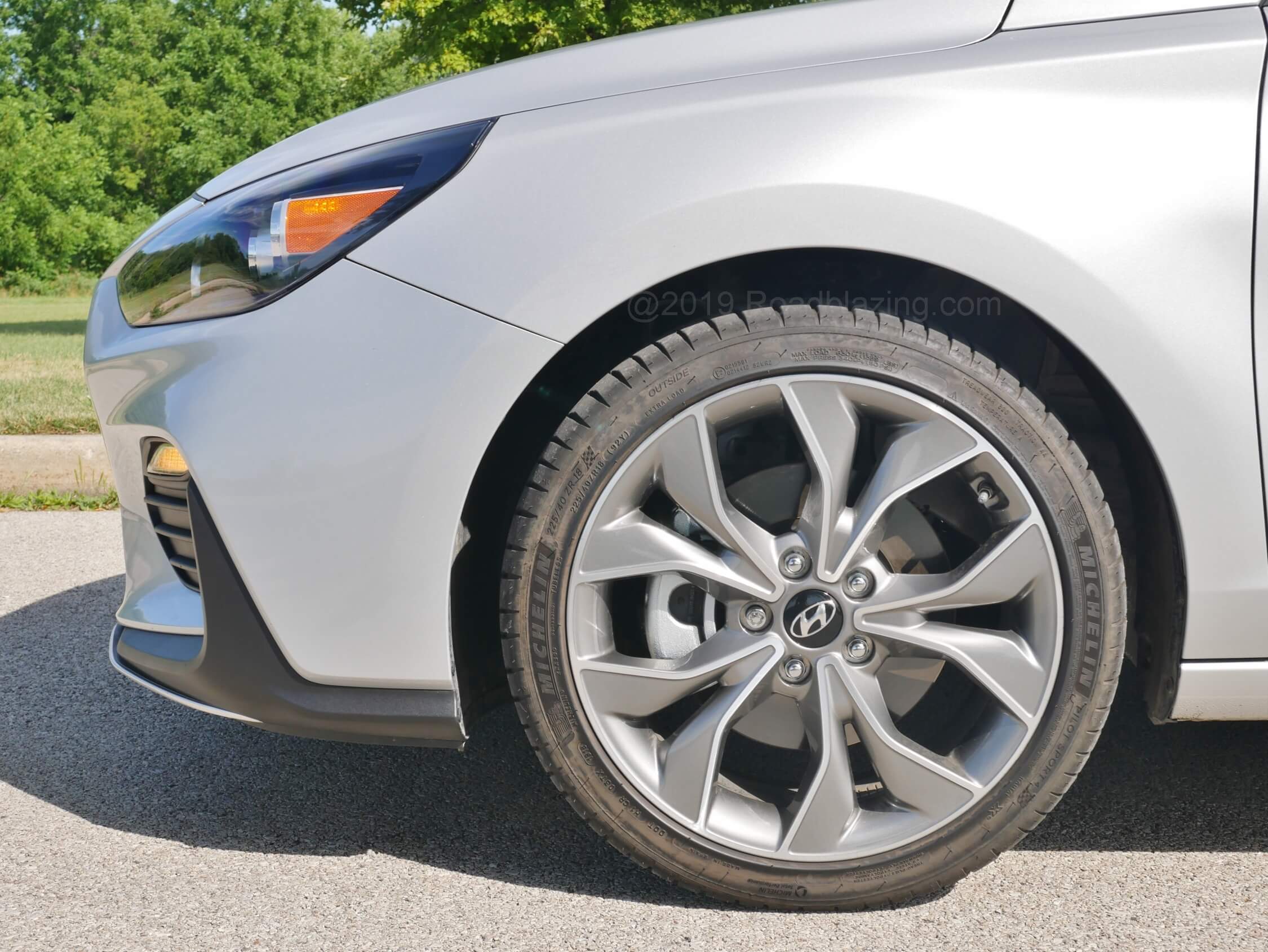 2019 Hyundai Elantra GT N-Line: Boosted spring rates, larger rear sway bar work with the gifted Michelin Pilot Sport 4 summer rubber for truly progressive mostly tug free tenacity, giving up little in daily driving civility. Once speed builds the steering rack winds rapidly and plus sized brake rotors render consistent feeling speed scrub.