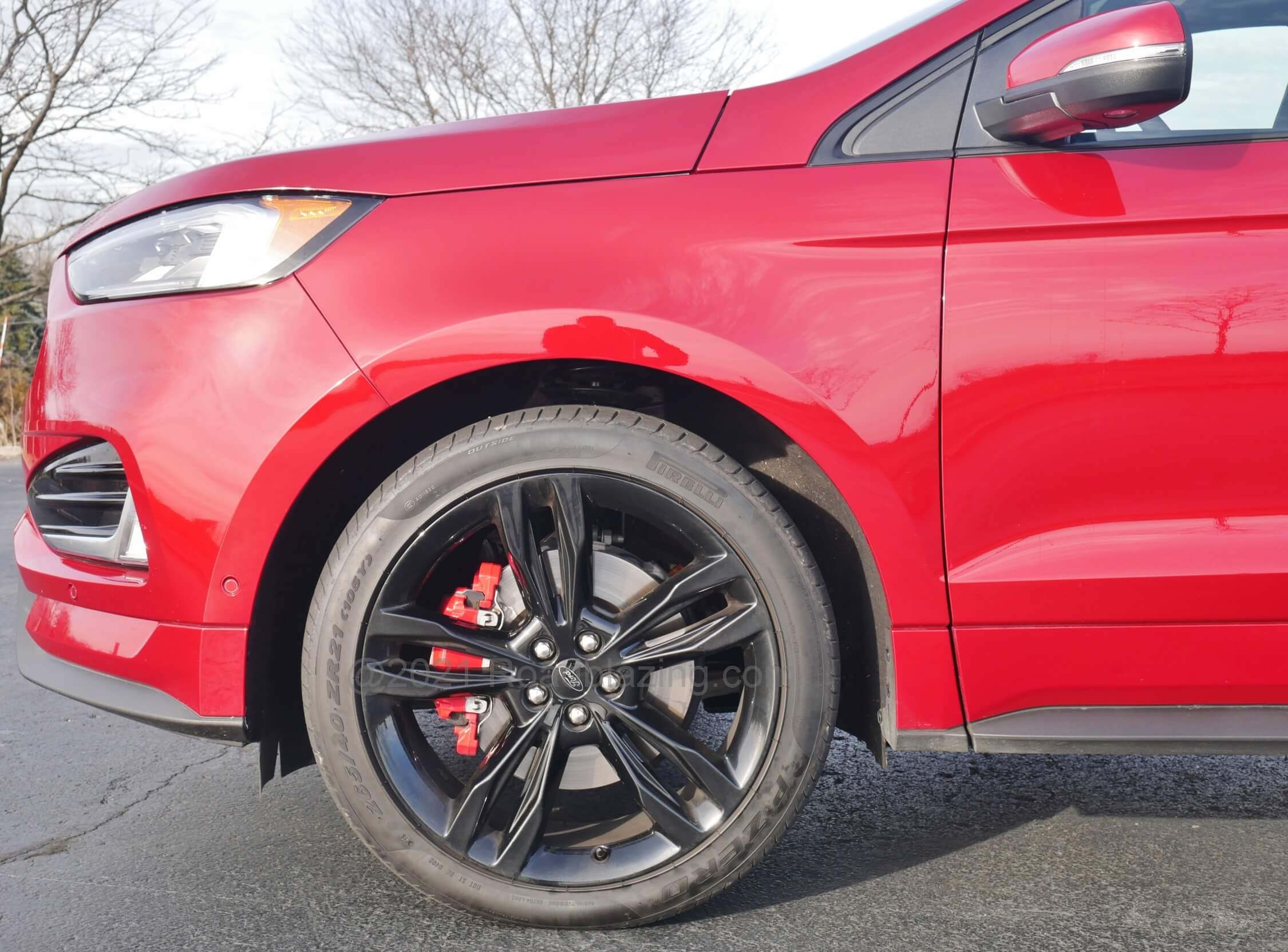 2020 Ford Edge ST: Massive 21" wheels bounded in 265/40 summer performance rubber compromise compliance. Hefty steering is rapid and turn in sharp despite top heaviness
