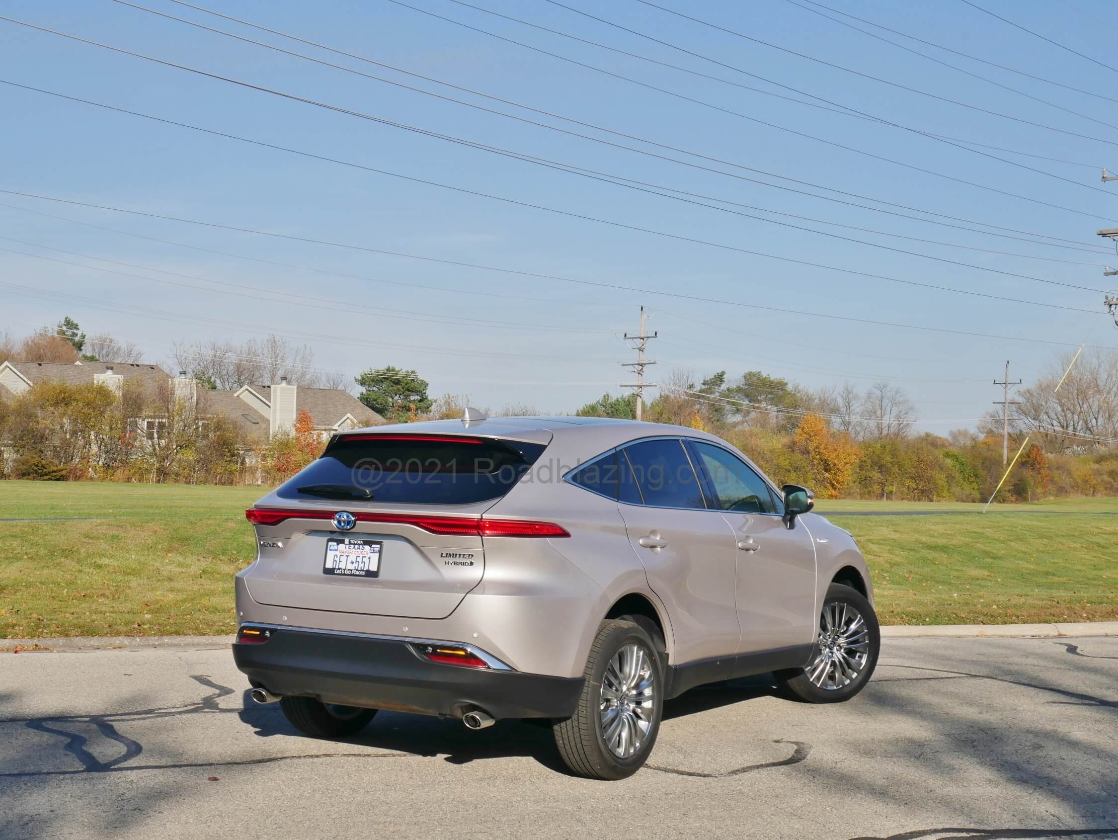 2021 Toyota Venza Hybrid Limited: A floating roof and sloped liftgate with thin racetrack style full wrap-around LED taillamps bear a resemblance to the Jaguar F-Pace