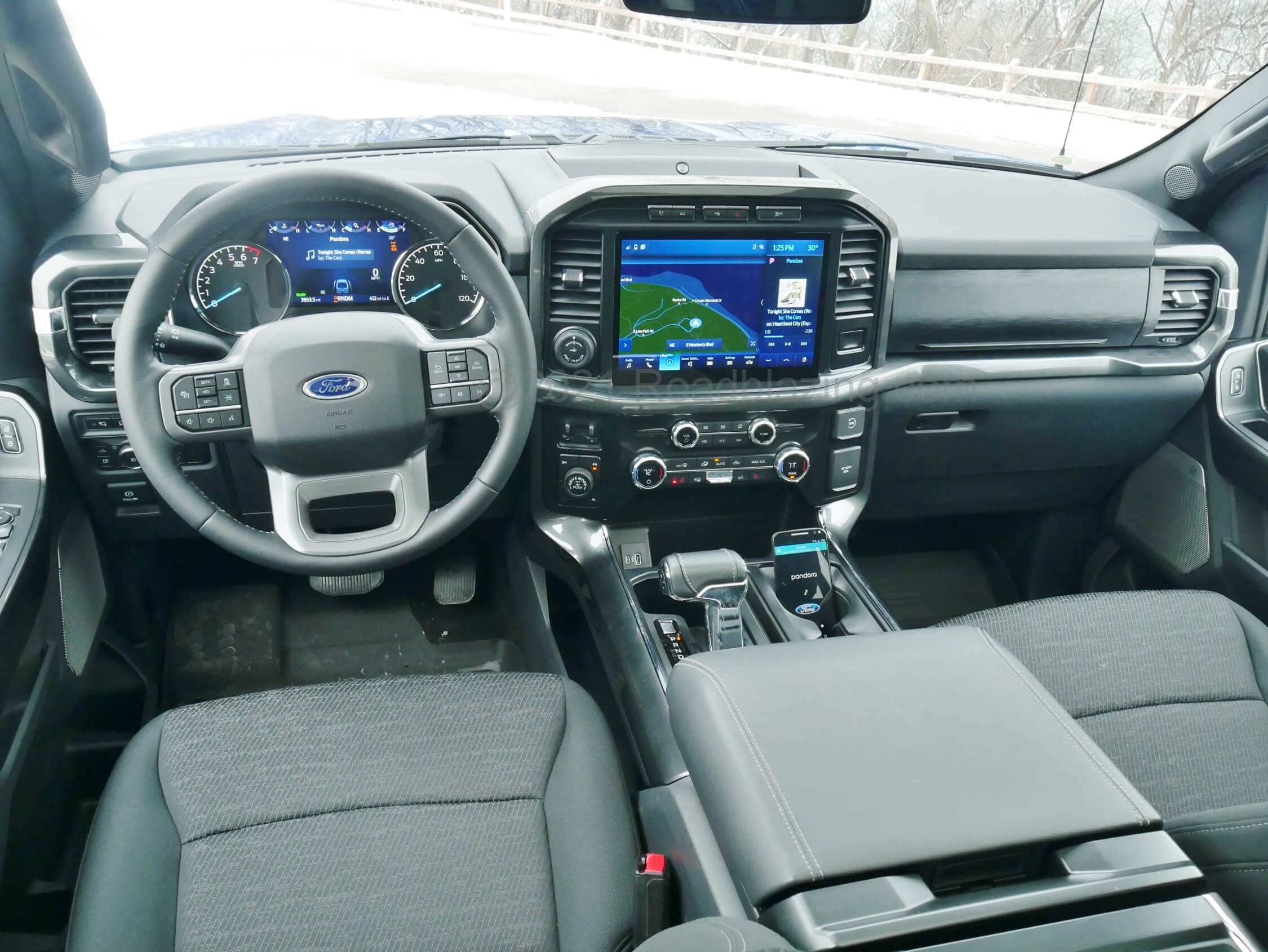 2021 Ford F-150 Supercrew XLT 4x4 PowerBoost hybrid: modern hi-tech pickup cockpit dominated by large TFT gauge cluster and 12.0" landscape touch to swipe LCD infotainment screen