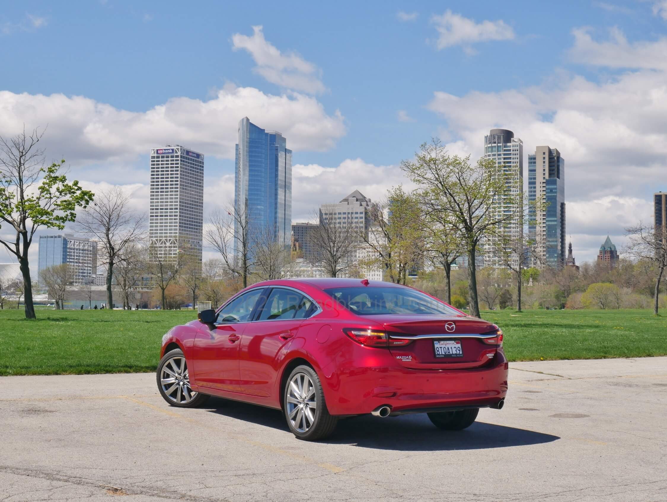 2021 Mazda 6 Signature 2.5T: Cloaked in passionate Soul Crystal Red, the sensuous yet muscular profile basks in Milwaukee, Wisconsin's Lake Michigan lakefront.