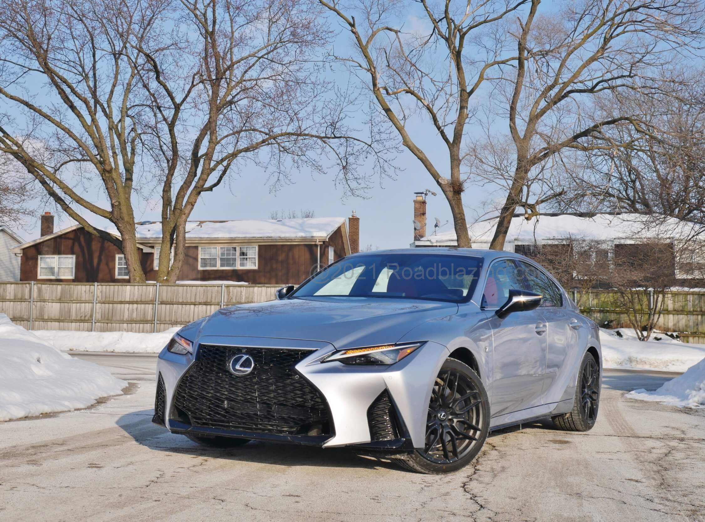 2021 Lexus IS 350 AWD: fully darkened assertive take on widened Lexus spindle grille, w. revised corner folded aero ducts