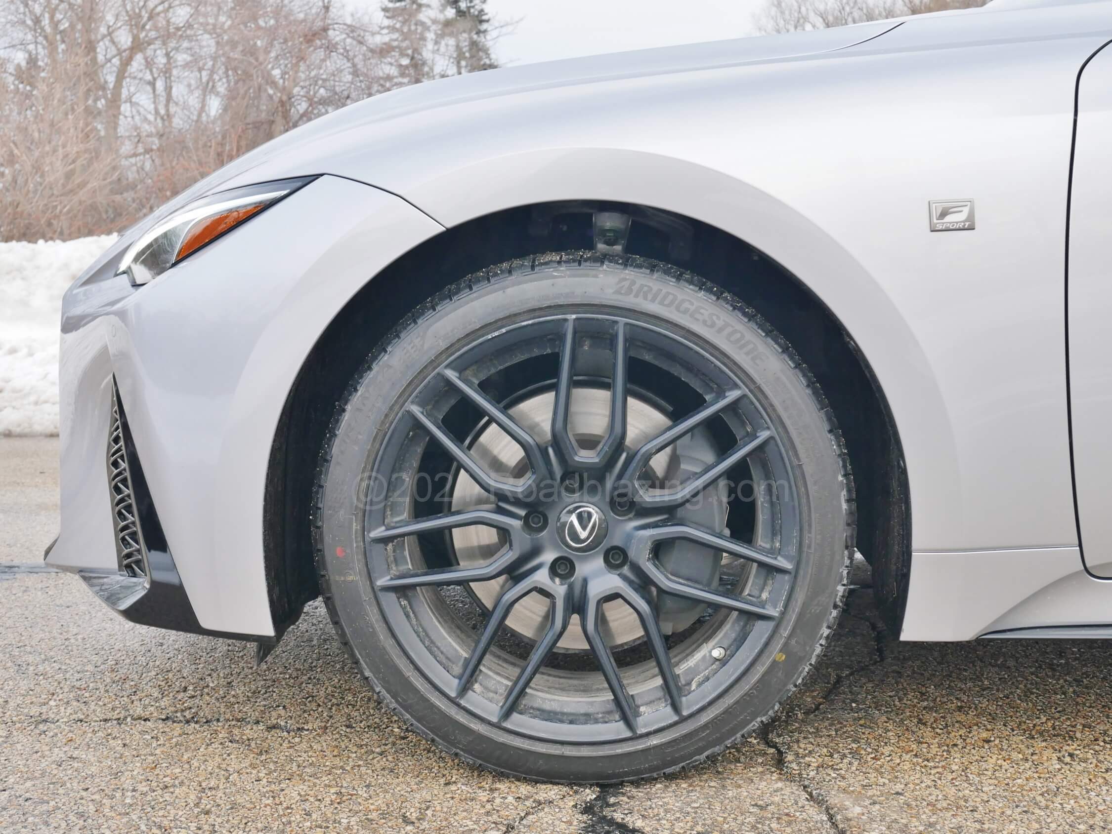 2021 Lexus IS 350 AWD: $3800 Dynamic Pkg swaps in 19" BBS matte black alloys + electronic variable damping, while AWD models make do with all-season rubber.