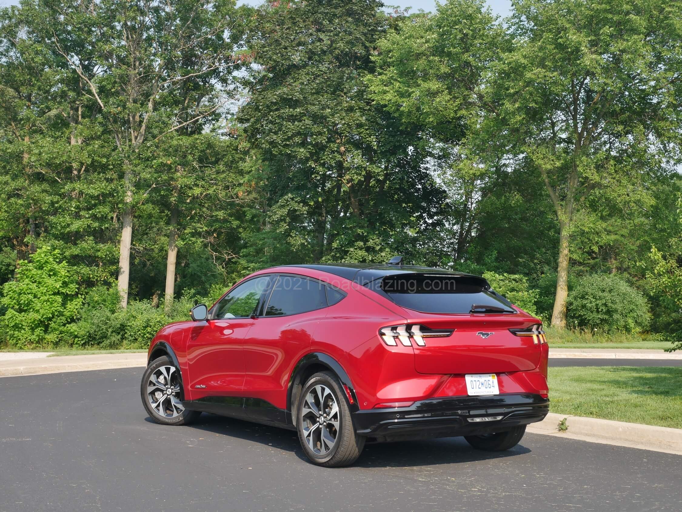 2021 Ford Mustang Mach-E Premium AWD: a lifted stance and long slope Kammback rear liftgate makes = crossover sport activity vehicle