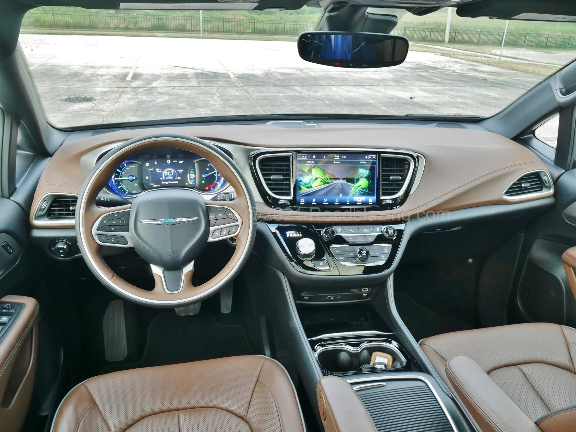 2021 Chrysler Pacifica Limited Hybrid PHEV: a cockpit of saddle leathers and folded seam soft panels, flat surfaces, embedded touch LCD screens