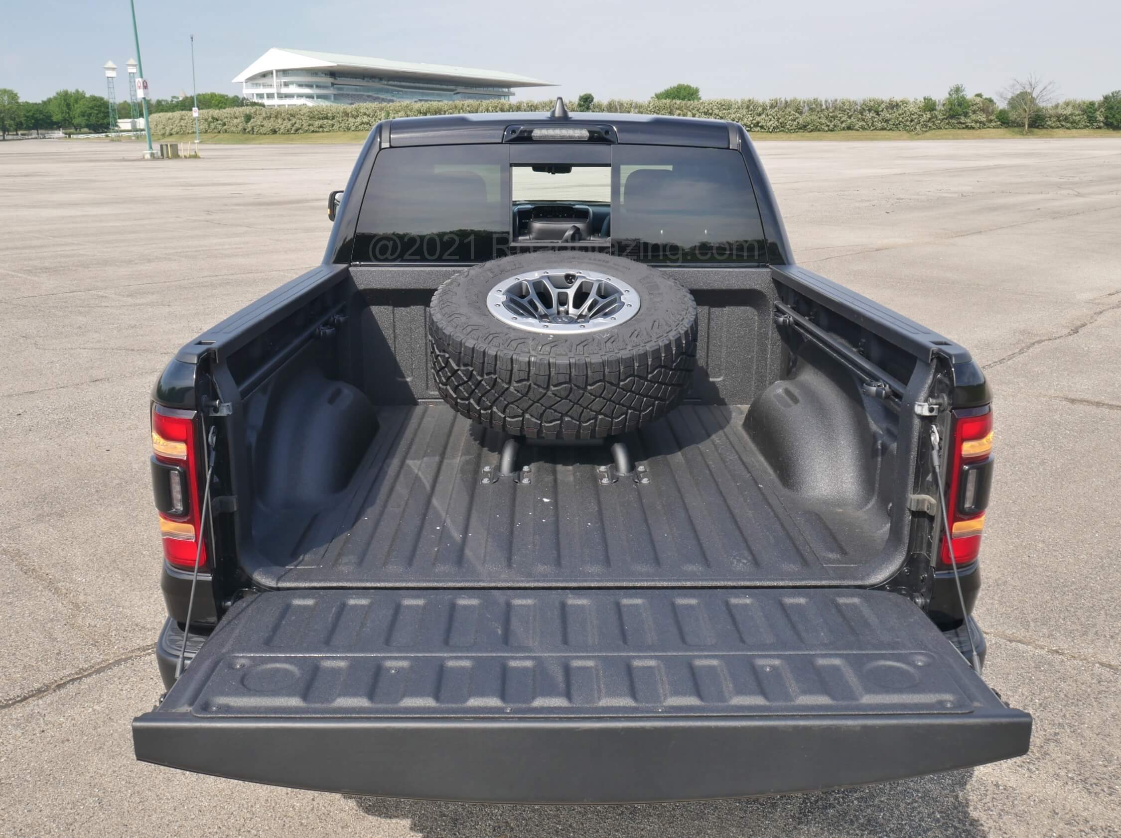 2021 RAM 1500 TRX Crew Cab 4x4: 5.5 ft box with spray-in liner overtaken by full size spare tire + wheel