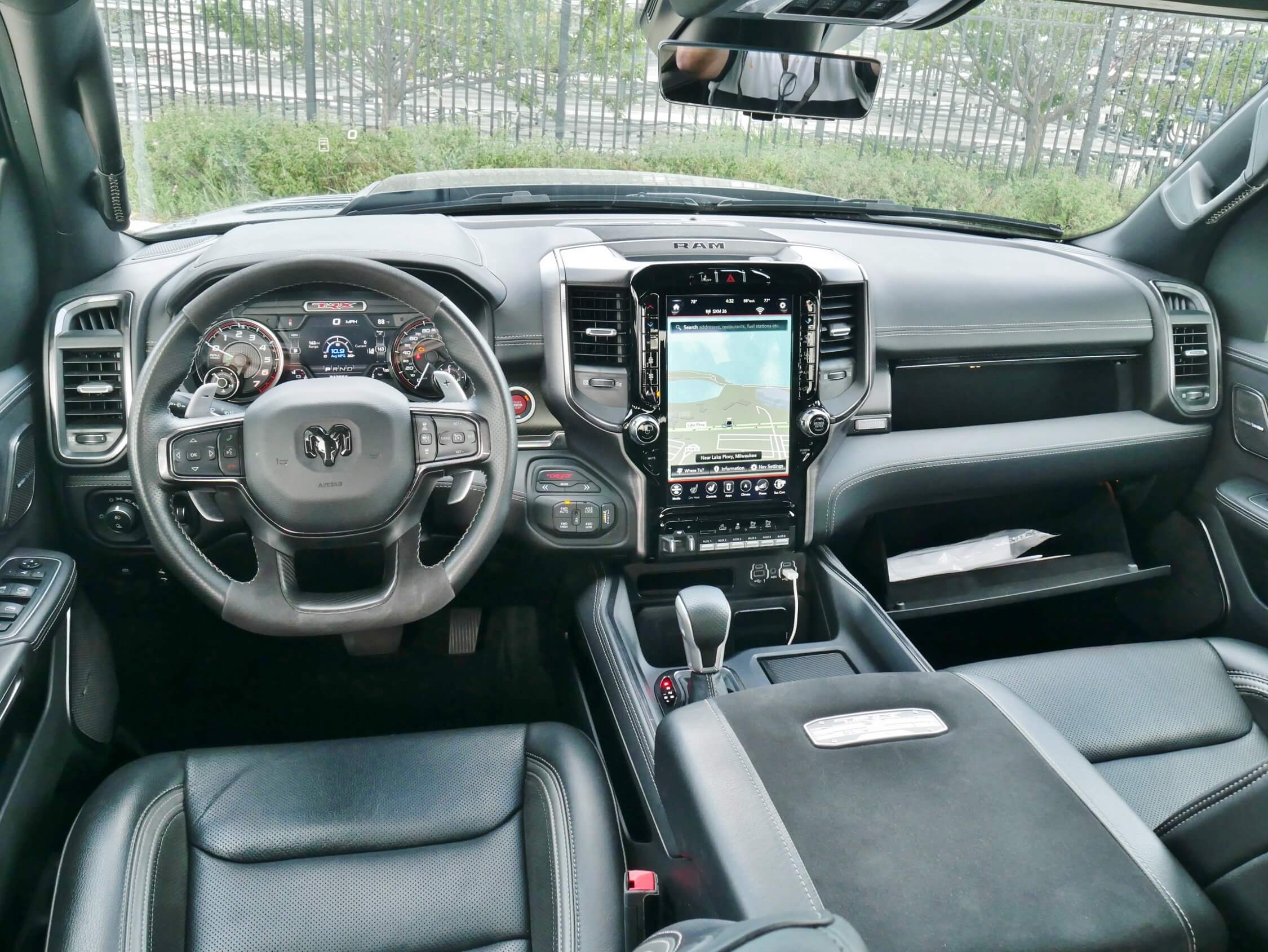 2021 RAM 1500 TRX Crew Cab 4x4: cockpit dominated by glove operable controls, 7.0" twin dial gauge cluster, 12.0" embedded portrait Uconnect 4.0 touch LCD infotainment, upper & lower gloveboxes