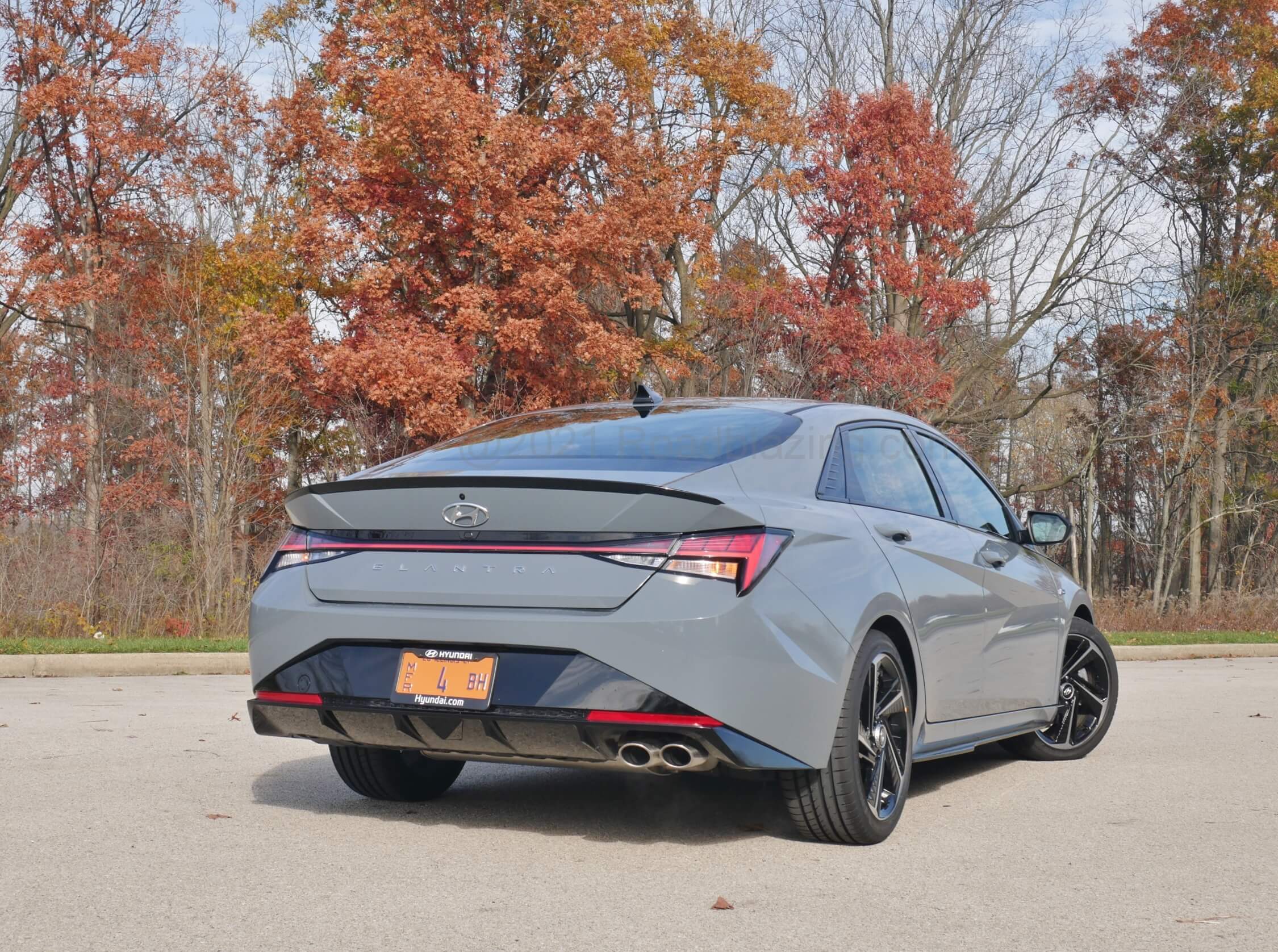 2021 Hyundai Elantra N-Line 1.6T: subtle darkened trunk lid spoiler, followed by raceway unified taillamps, lower valance diffuser