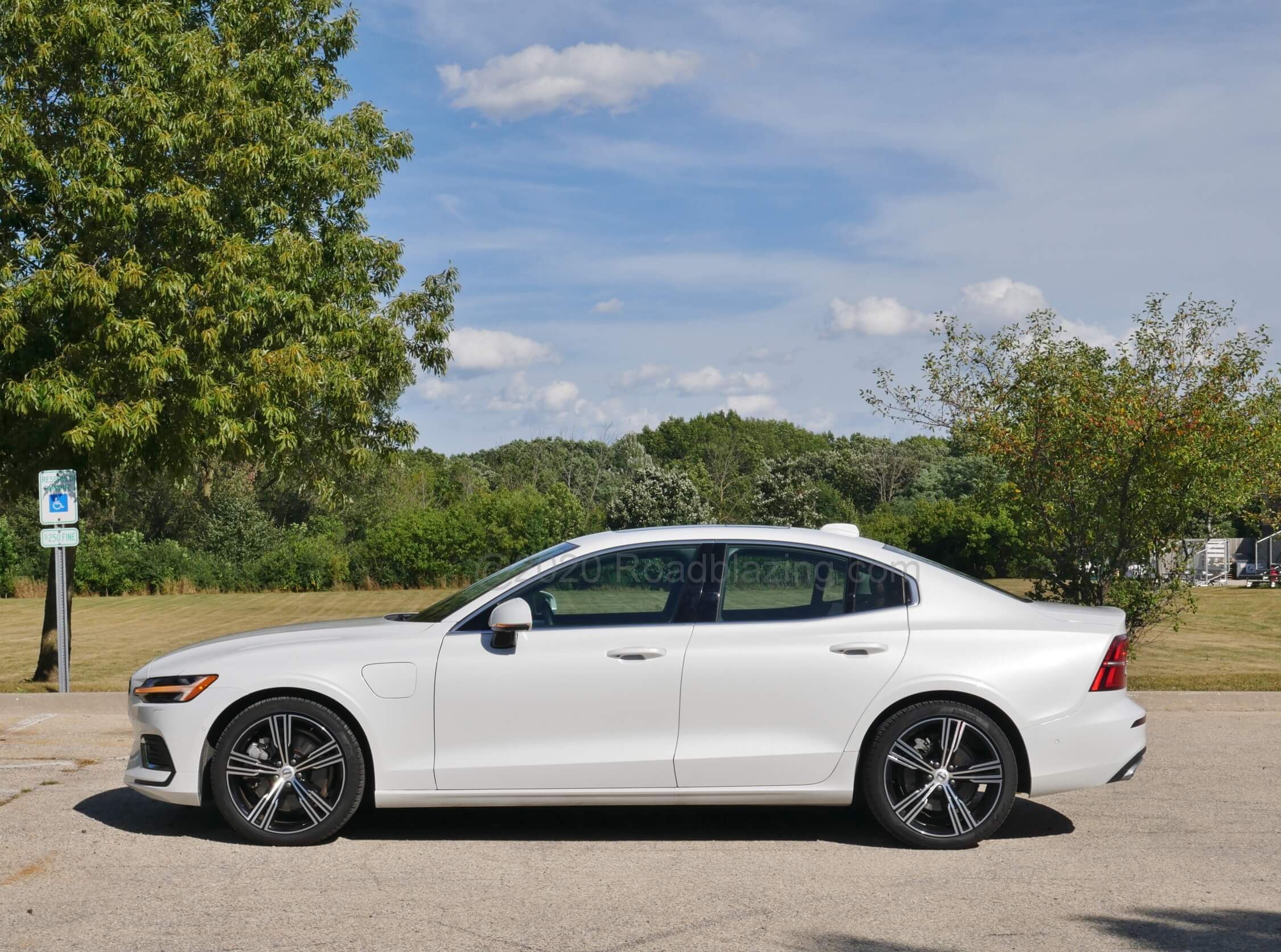2020 Volvo S60 T8 AWD PHEV: Crystal White Pearl shimmers on the sleek Coke bottle profile
