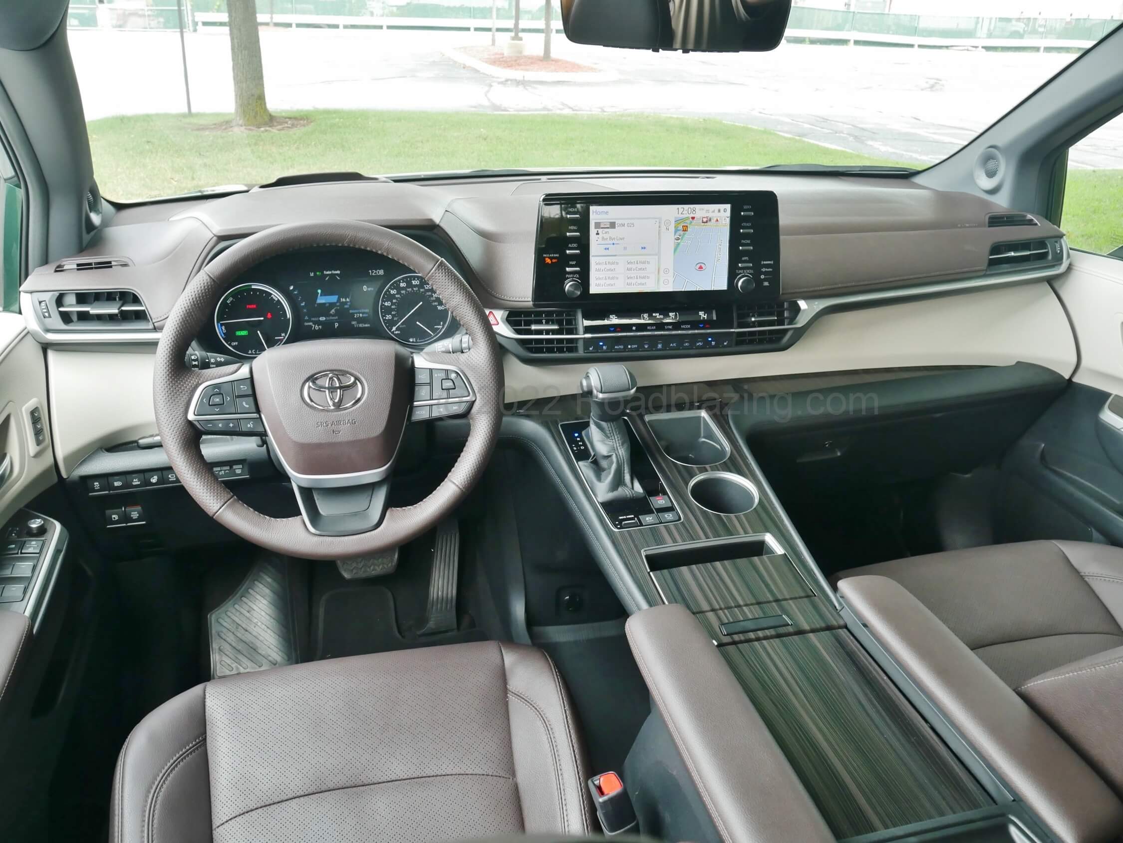2021 Toyota Sienna Hybrid Platinum AWD: two tone tiered soft dash panels, oversized switches and a large 12.3" landscape media display emit modern luxury