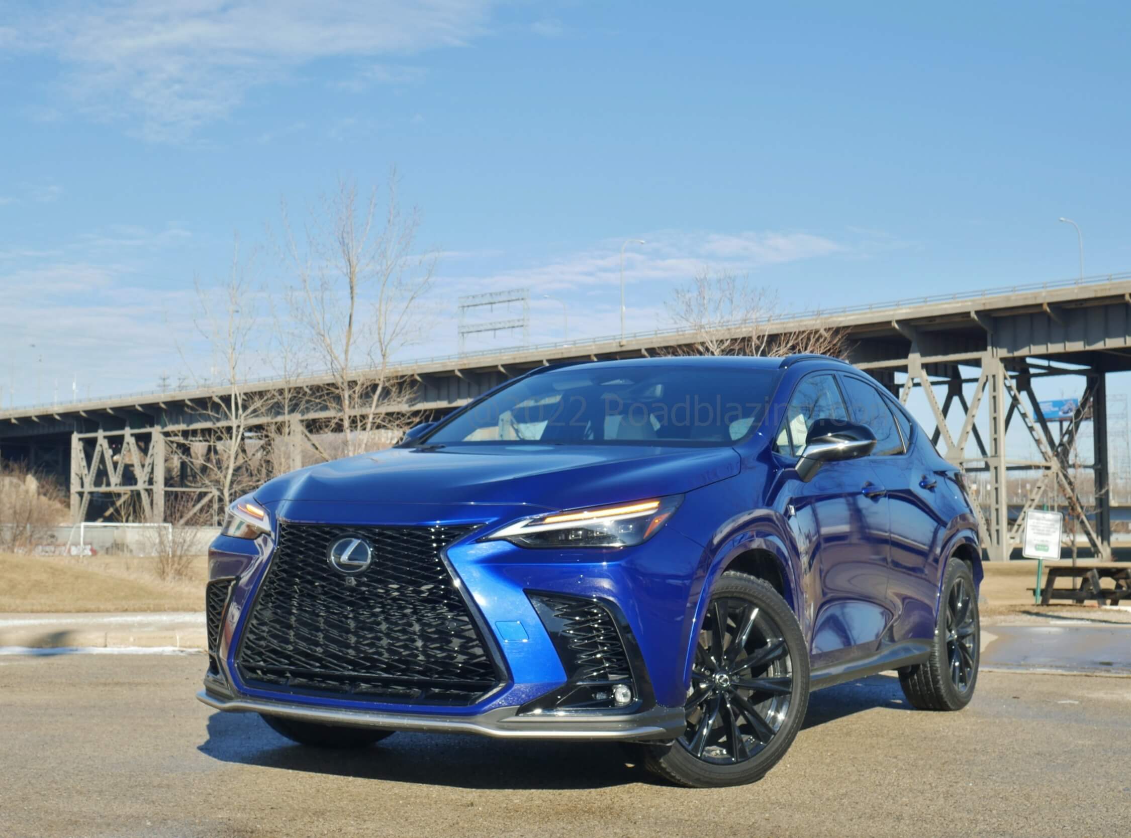 2022 Lexus NX 450h+ F-Sport AWD: more upright, fully descending Spindle grille and corner fangs, all darkened