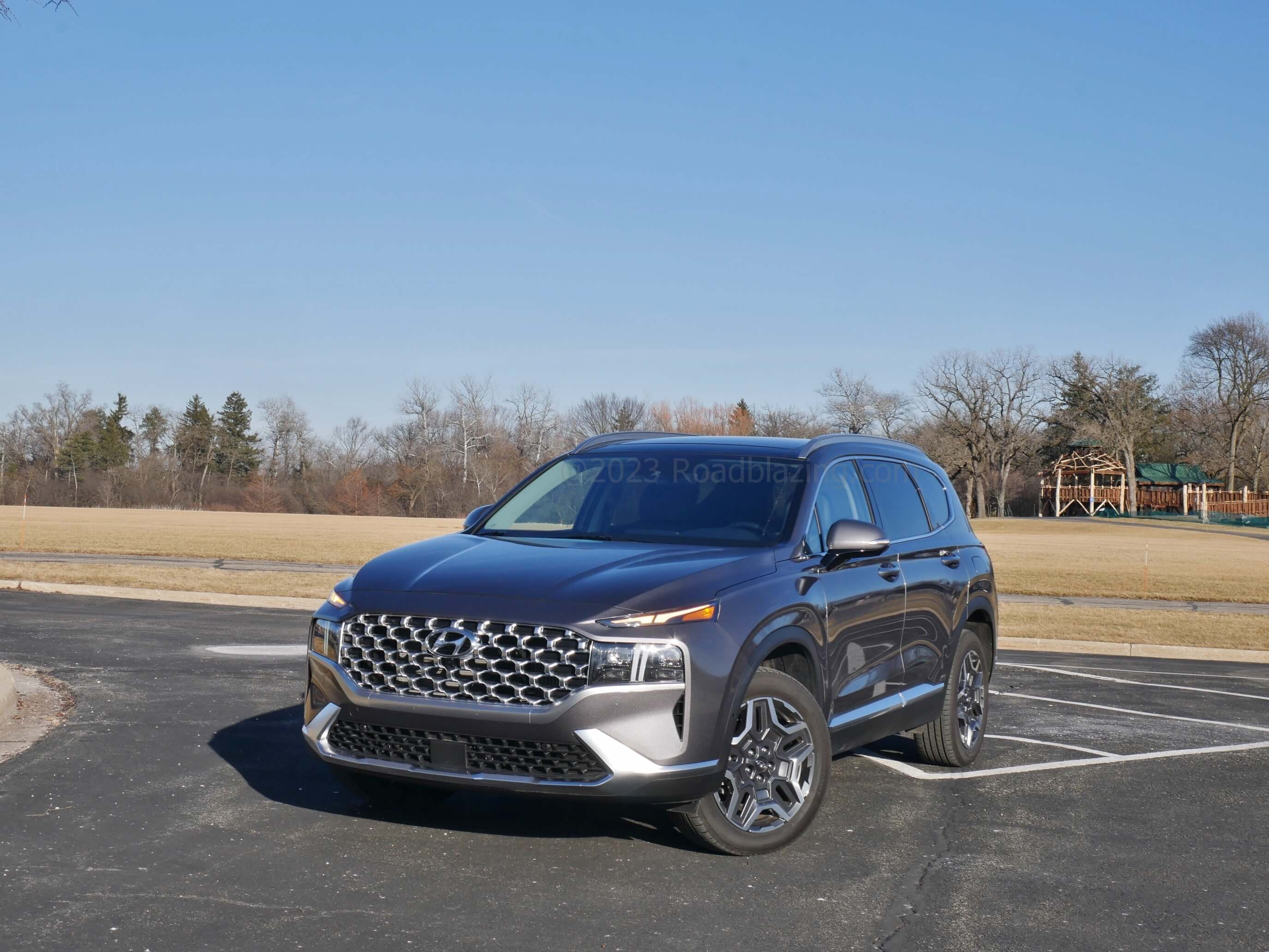 2022 Hyundai Santa Fe Limited PHEV AWD: wide poured molten grille flanked by LED headlamps, underscored by folded corner fangs