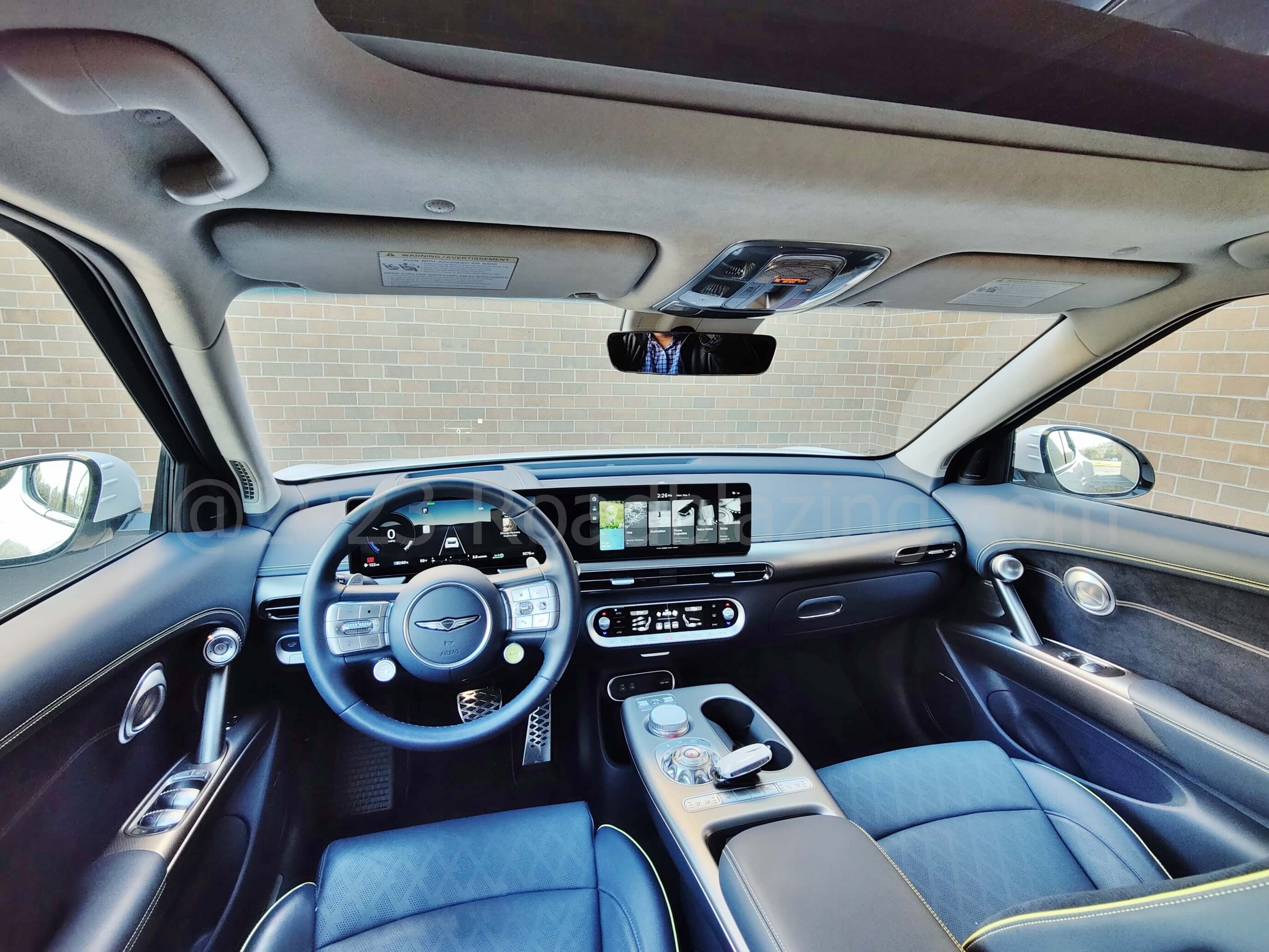 2022 Genesis GV60 Performance AWD EV: gold on torrent blue cabin panel finish = classy