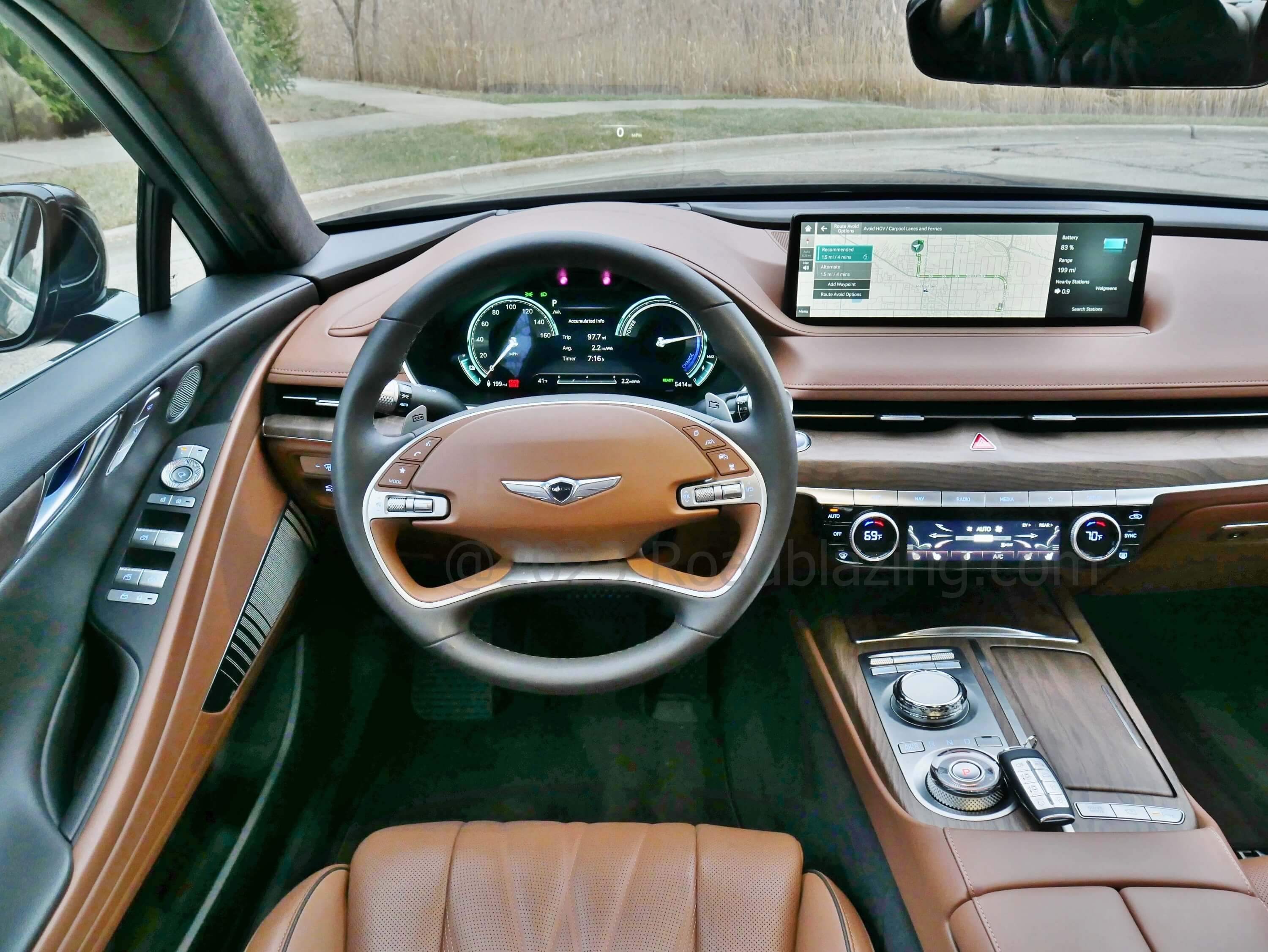 2023 Genesis Electrified G80 AWD: traditional twin dial instrument cluster supplemented by 14+" panoramic touch & remote knob controlled infotainment display