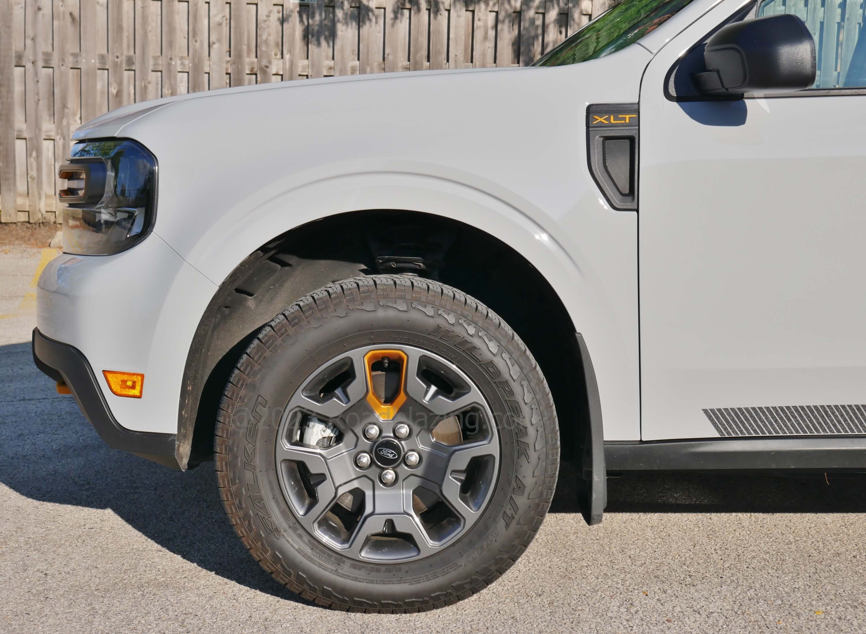 2023 Ford Maverick XLT Tremor AWD: 17" smoked wheels with single orange spoke wrapped in Falken Wildpeak all terrain tires