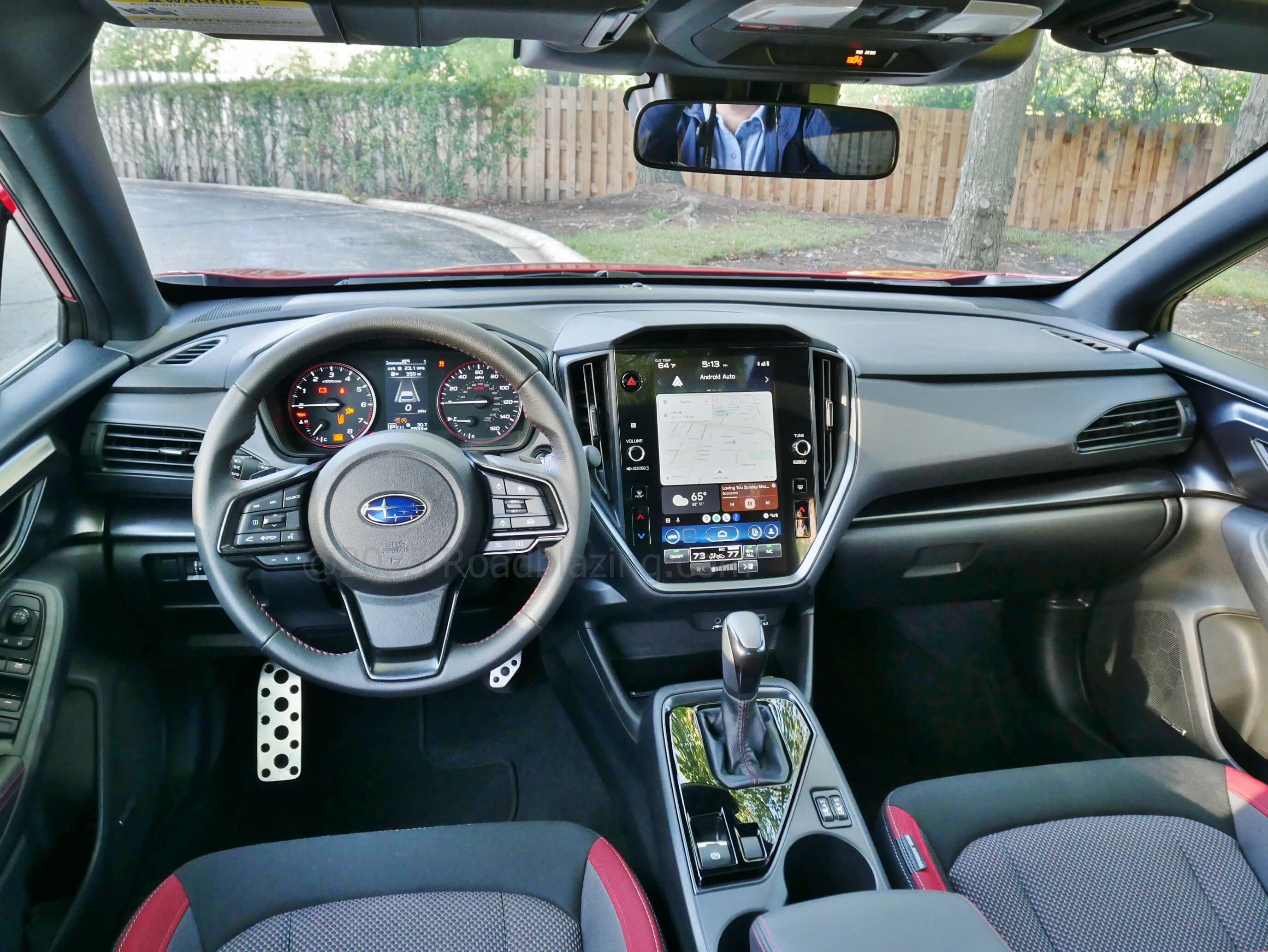 2023 Subaru Impreza RS: cockpit w/ traditional analog instruments, abundant gloss black accents, low cowl for excellent outward view