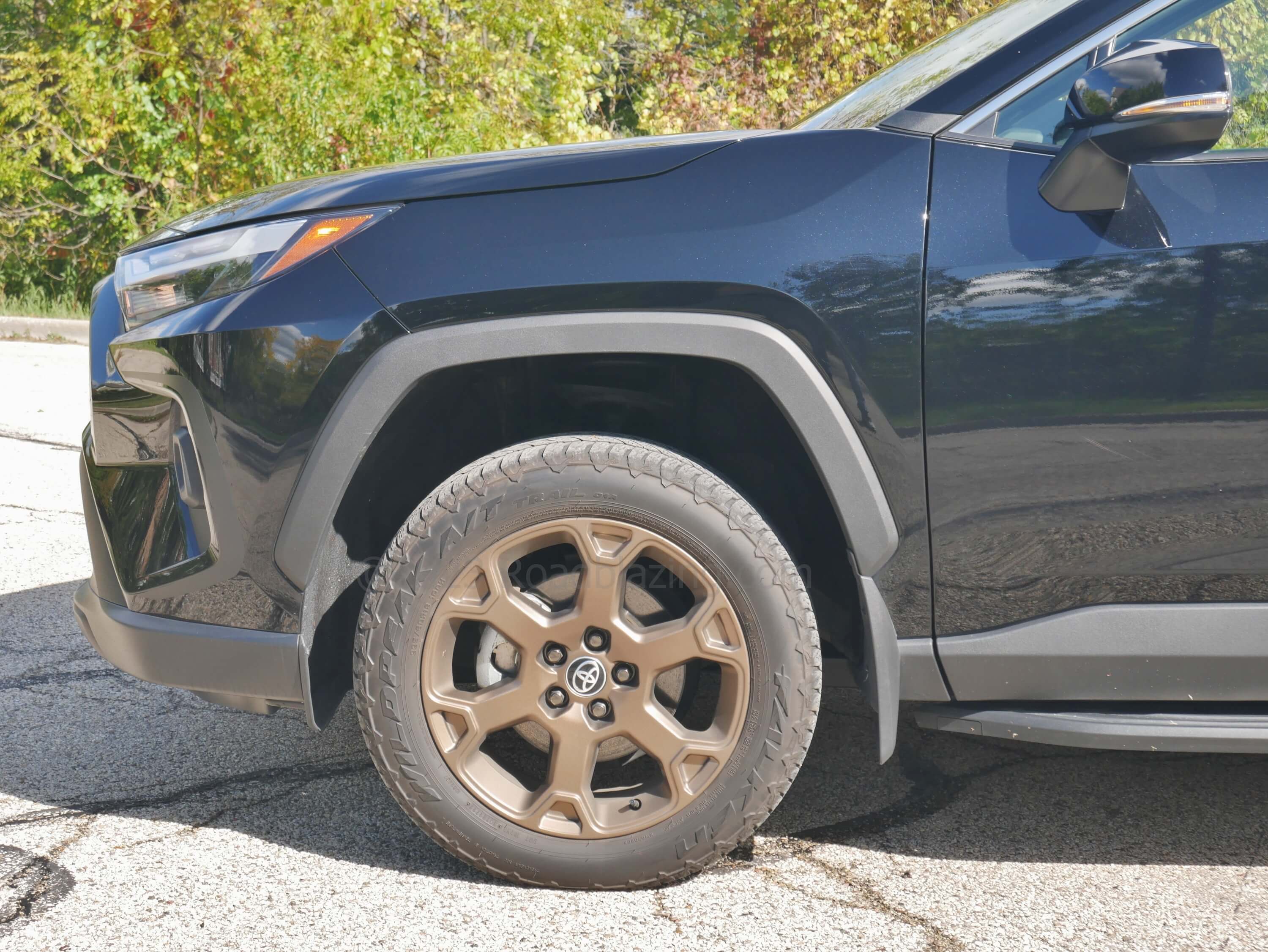 2023 Toyota RAV4 Hybrid AWD Woodland Edition: unique stronger cast bronzed 18" alloy wheels banded in Falken all terrain trail tires